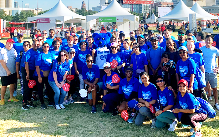 BCBSTX employees pose together at outdoor event
