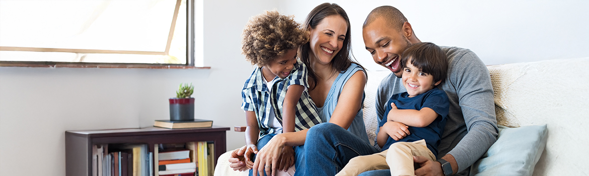 family sitting on couch