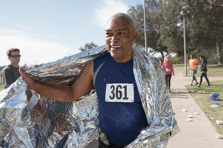 Man smiling after successfully completing a marathon