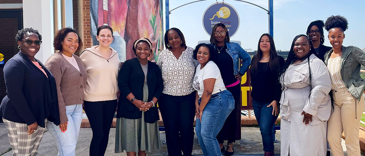 A group of womenpose for a photo