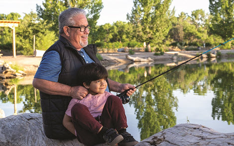 Boy and grandpa fishing