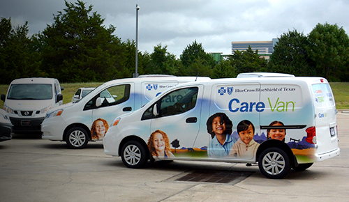 Fleet of Care Vans parked together.