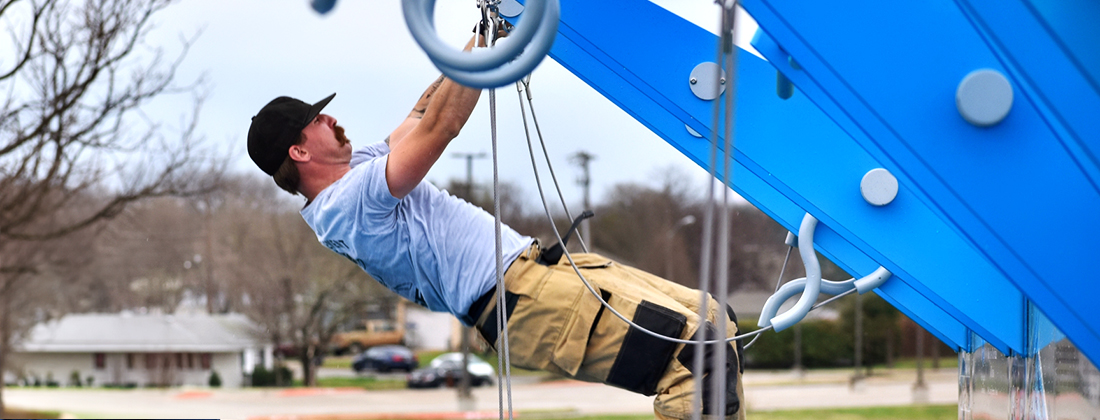 Fireman works out on public fitness court